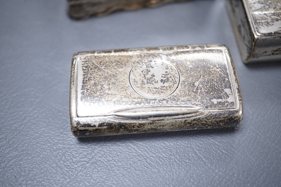 A Victorian silver ovoid snuff box, Henry William Dee, London, 1874, 58mm, together with two George V silver snuff boxes.